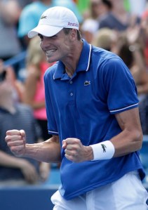 John Isner celebrates his win over world number One Novak Djokovic. (Thanks to sports. nationalpost.com)