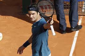 Federer raises his magic wand to the Monte-Carlo crowd. (thanks to www.abc.net.au)