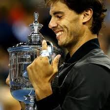 Nadal holds his trophy close (Thanks to belfasttelegraph.com)